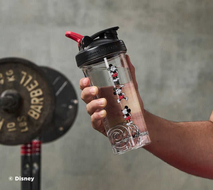 pro-series-t7 Mickey_Mouse_Protein_Shaker_Bottle_Being_Held_In_the_Gym.jpg